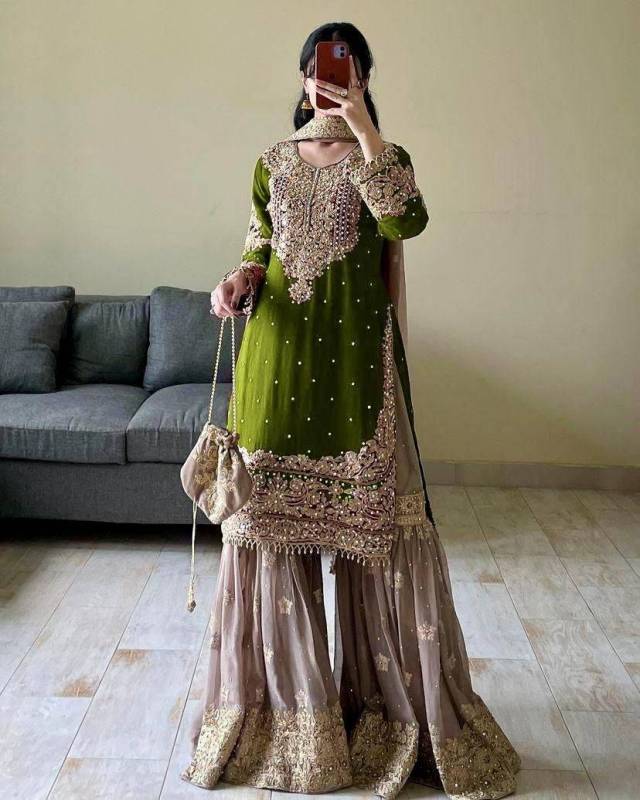 Faux Georgette sharara palazzo set features a top with real mirror and coding sequence embroidery. 