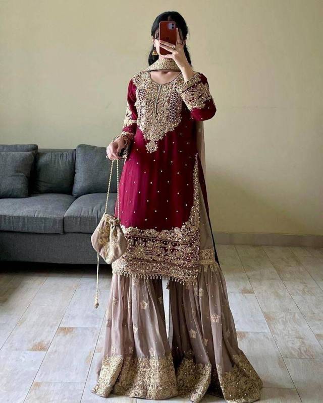 Faux Georgette sharara palazzo set features a top with real mirror and coding sequence embroidery. 