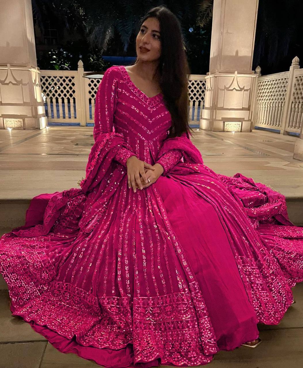 Elegant three-piece ensemble featuring a faux georgette top and lehenga with dupatta