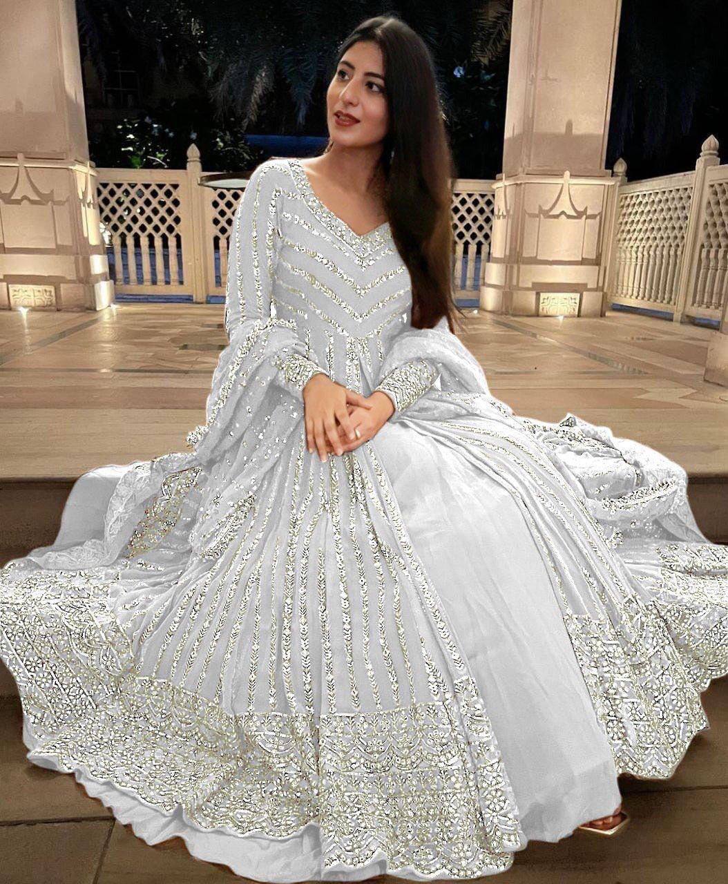 Elegant three-piece ensemble featuring a faux georgette top and lehenga with dupatta